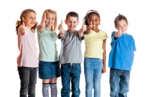 group of smiling kids who found a great pediatric dentist Steven Ellinwood DDS with comprehensive family dentistry services in Fort Wayne IN